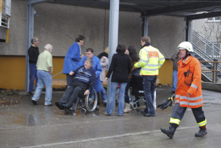 People are evacuated from the scene of a fire in a workshop for disabled people in Titisee-Neustadt