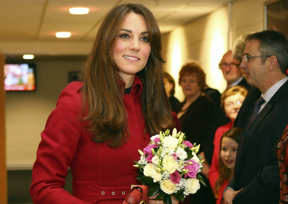 Catherine, Duchess of Cambridge holds a bouquet of flowers as she arrives at the Autumn International rugby match between Wales and New Zealand at the Millennium Stadium in Cardiff