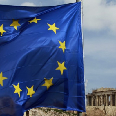 A European Union flag is seen in front of the Parthenon temple in Athens