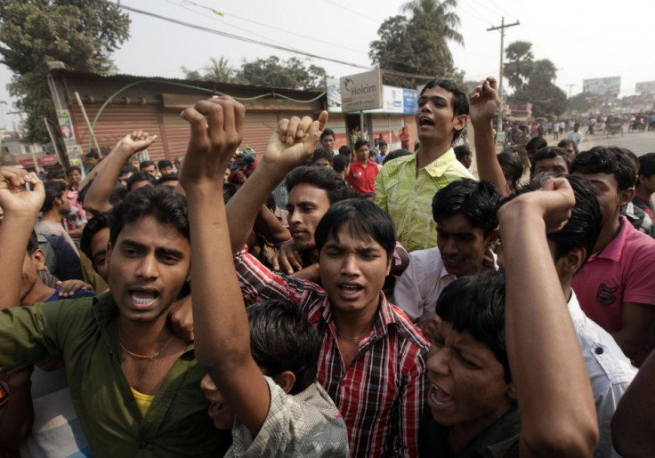 Garment workers chant slogans during a protest against the death of their colleagues in a devastating fire, in Savar