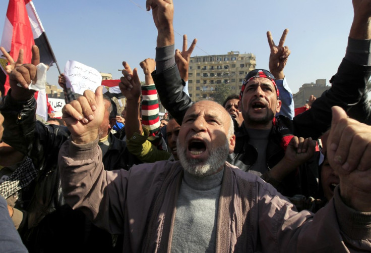 Anti-Mursi protesters chant anti-government slogans at Tahrir Square in Cairo