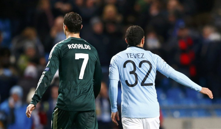 Cristiano Ronaldo and Carlos Tevez (R)