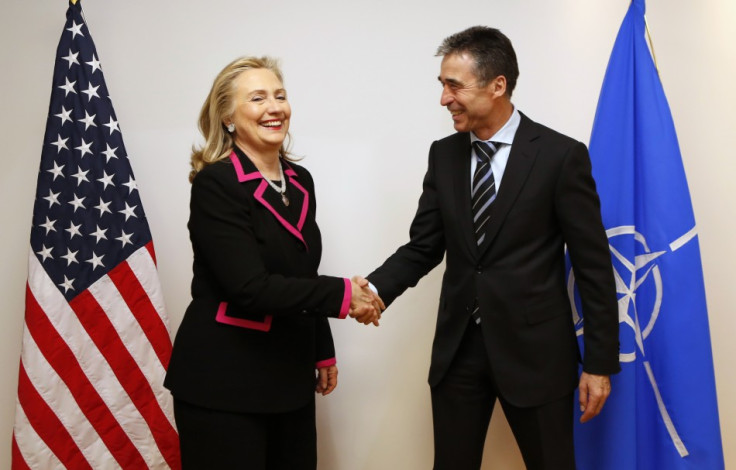U.S. Secretary of State Hillary Clinton shakes hands with NATO Secretary-General Anders Fogh Rasmusse