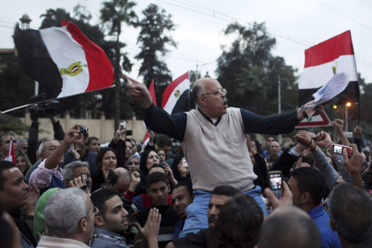 A protester chants anti-Mursi slogans in front of the presidential palace in Cairo