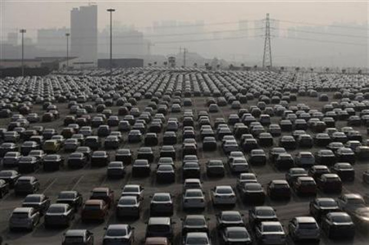 New cars are seen at a parking lot of Changan Ford Mazda Automobile Co. Ltd, Ford Motor's joint venture in China, in Chongqing Municipality