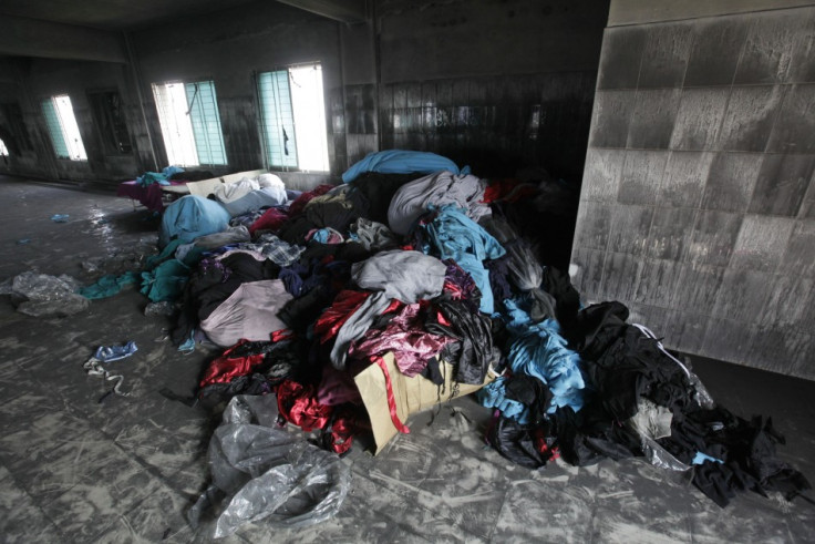 Clothes and sewing machines are seen in the Tazreen Fashions garment factory, where 112 workers died in a fire, in Savar