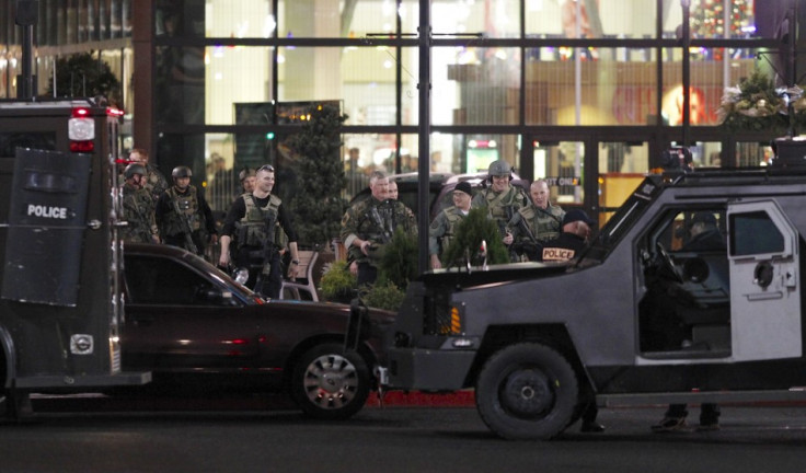 Police exit the Clackamas Town Center shopping mall in Portland (Reuters)