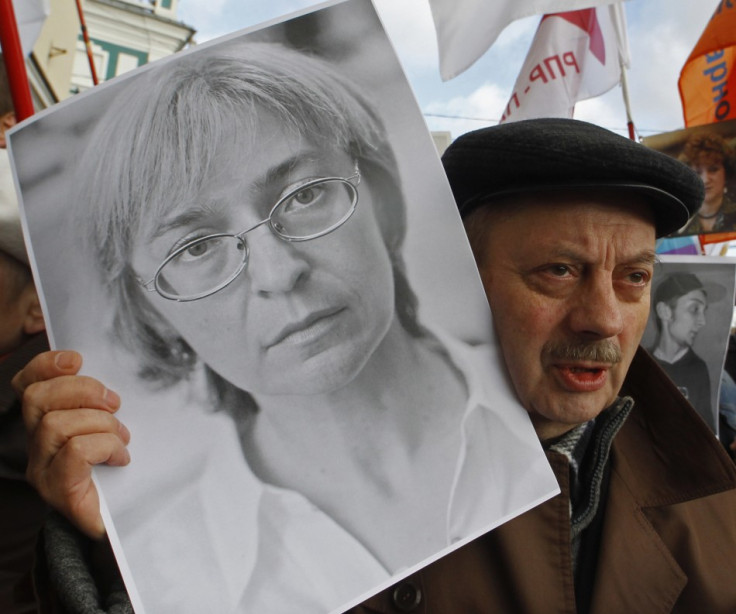 A participant holds a portrait of assassinated human rights activist Politkovskaya during a "March against hatred"