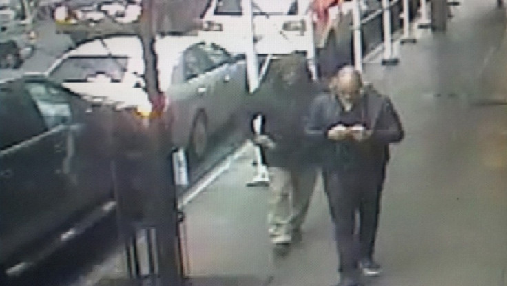 A video still image of a gunman pulling a weapon behind Brandon Lincoln Woodard in New York