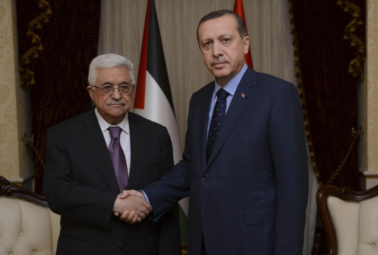 Palestinian President Abbas shakes hands with Turkey's Prime Minister Erdogan during their meeting in Ankara