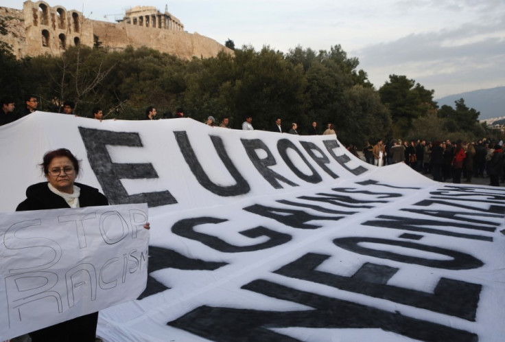 Protesters from across Europe hold a huge banner during a rally against the increase of racist attacks in Greece