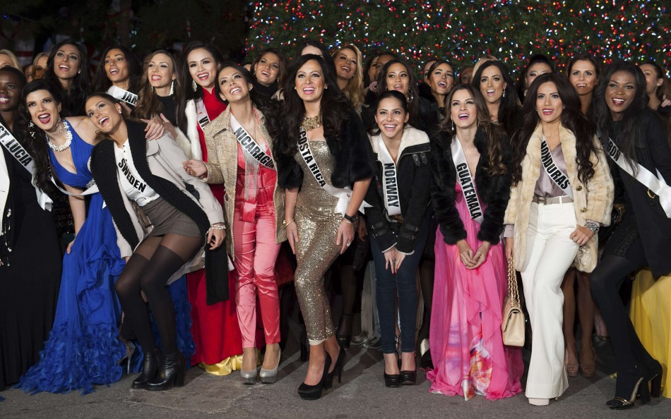 Miss Universe contestants pose during the Miss Universe National Gift Auction in Las Vegas
