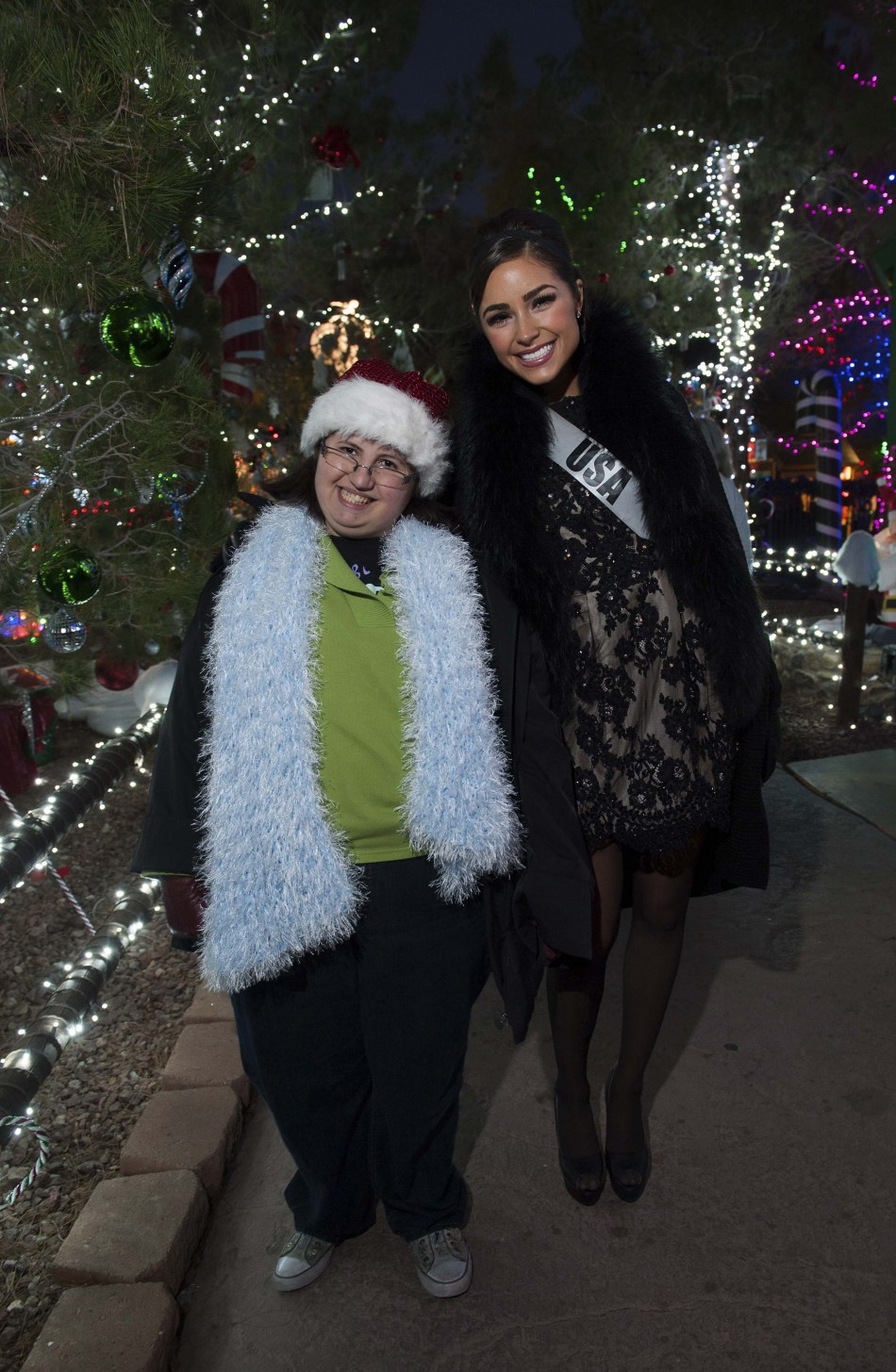 Miss USA Culpo poses with her Best Buddy during the Miss Universe National Gift Auction in Las Vegas