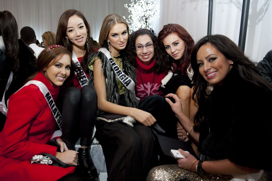 Miss Malaysia Leggett, Miss Korea Lee, Miss Georgia Shedania, Miss Germany Endemann and Miss Costa Rica Cascante pose with one of the Best Buddies during the Miss Universe National Gift Auction in Las Vegas