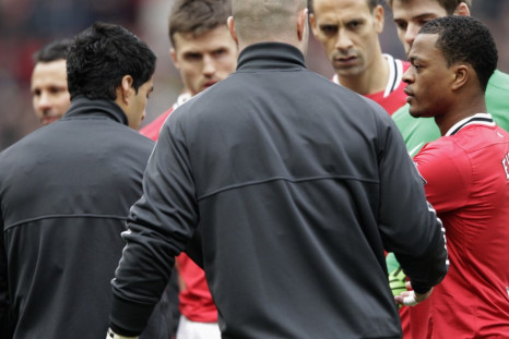 Luis Suarez and Patrice Evra