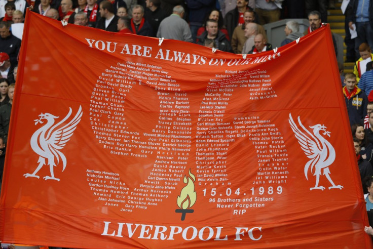 Supporters hold up a banner in memory of victims of the Hillsborough disaster at Anfield in Liverpool