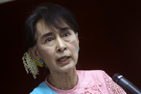 Myanmar pro-democracy Leader Aung San Suu Kyi talks to reporters during a news conference in Yangon