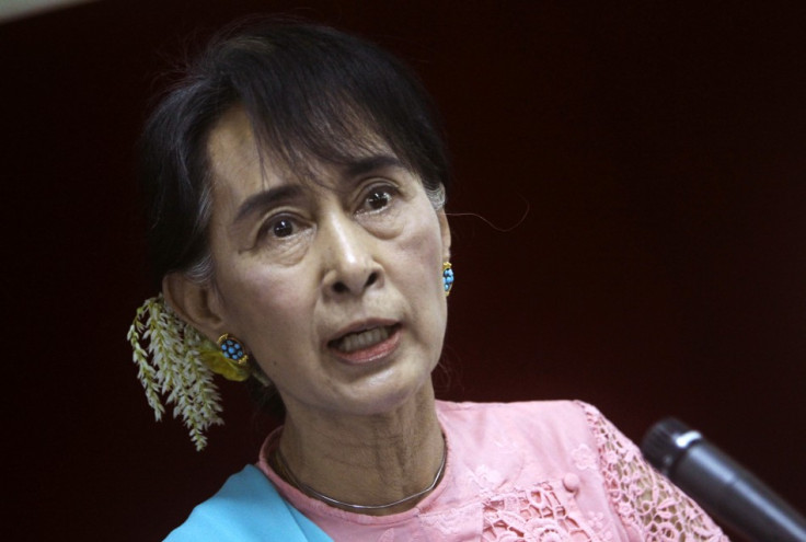 Myanmar pro-democracy Leader Aung San Suu Kyi talks to reporters during a news conference in Yangon