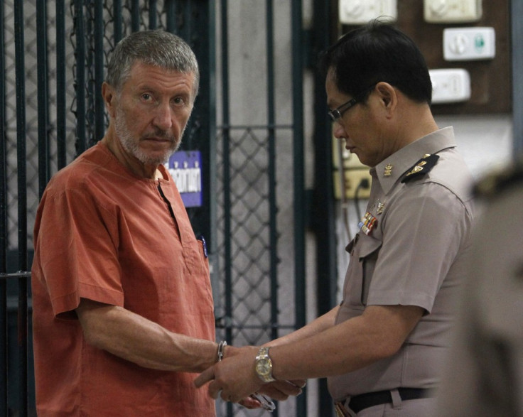 Italian suspect Vito Roberto Palazzolo, 65, is handcuffed near a prison cell at the criminal court in Bangkok