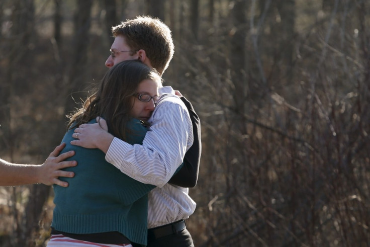 Sandy Hook: Shocked parents comfort each other after the massacre