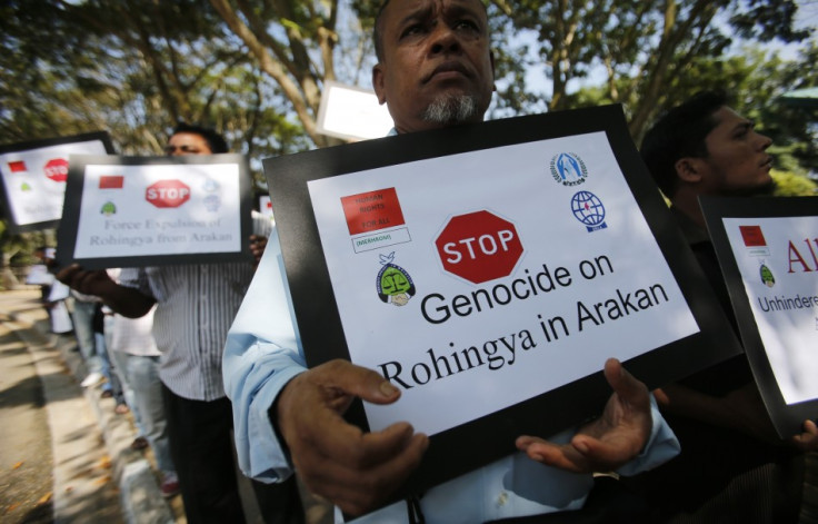 Myanmar people of Rohingya ethnicity who are living in Malaysia, display placards during a rally