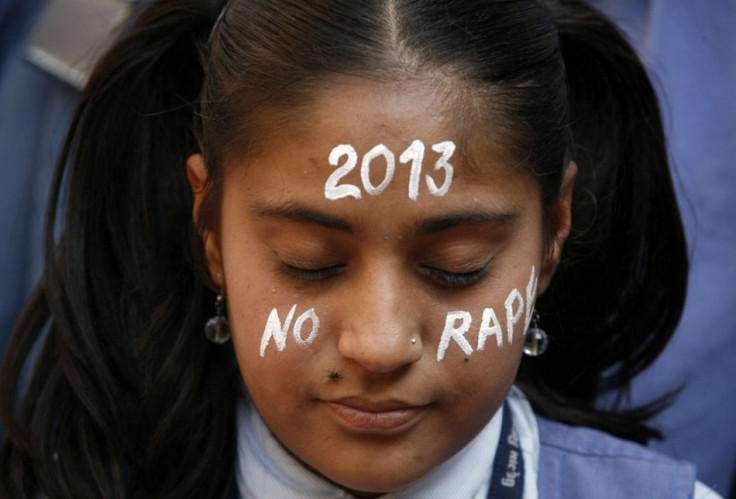 A student prays during a vigil for the Delhi gang rape victim
