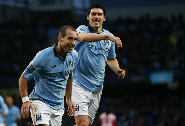 Manchester City's Pablo Zabaleta (L)