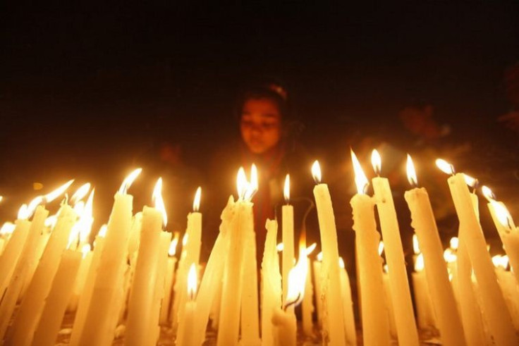 Citizens of the eastern Indian city of Kolkata hold a candlelight vigil