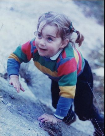 A rare photograph of Kate as a little girl, scrambling up and down grassy slopes... without a care in the world.