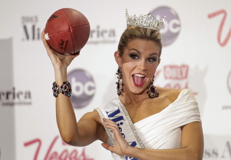 Miss America 2013 Mallory Hytes Hagan, Miss New York, poses with a football during a news conference in Las Vegas