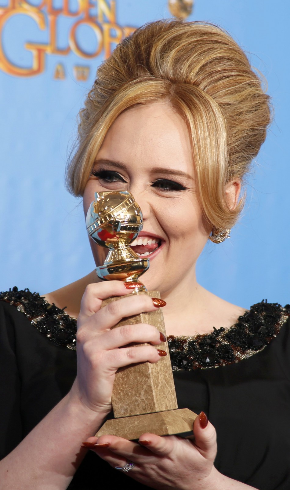 Adele, winner for Best Original Song - Motion Picture, for Skyfall from the film of the same name poses with her award at the 70th annual Golden Globe Awards in Beverly Hills