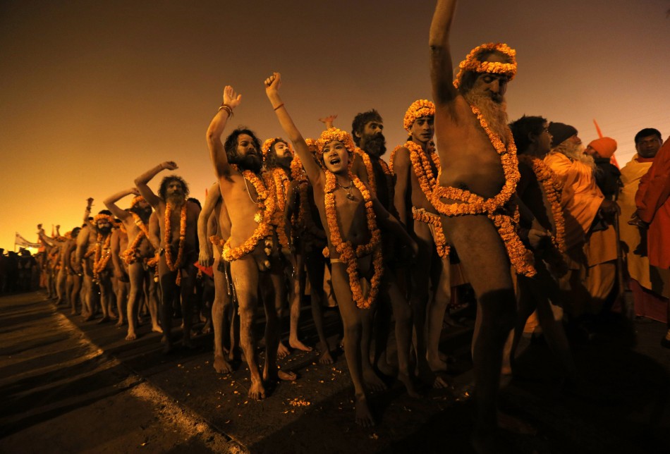 Naga sadhus or Hindu holymen arrive to attend the first Shahi Snan at the ongoing Kumbh Mela, or Pitcher Festival, in Allahabad