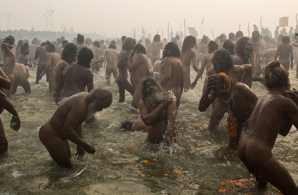 Naga sadhus or Hindu holymen attend the first Shahi Snan at the ongoing Kumbh Mela, or Pitcher Festival, in Allahabad
