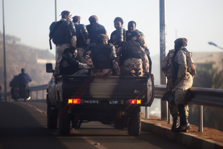 Malian soldiers drive through the streets of Bamako