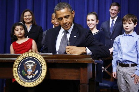President Barack Obama signs executive orders on gun violence at the White House (Reuters)