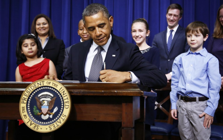 President Barack Obama signs executive orders on gun violence at the White House (Reuters)