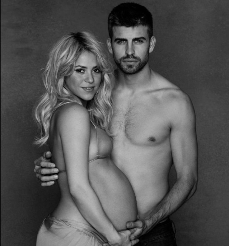 Shakira shows off bare baby bump with soccer star beau Gerard Piqué, hosts online baby shower.