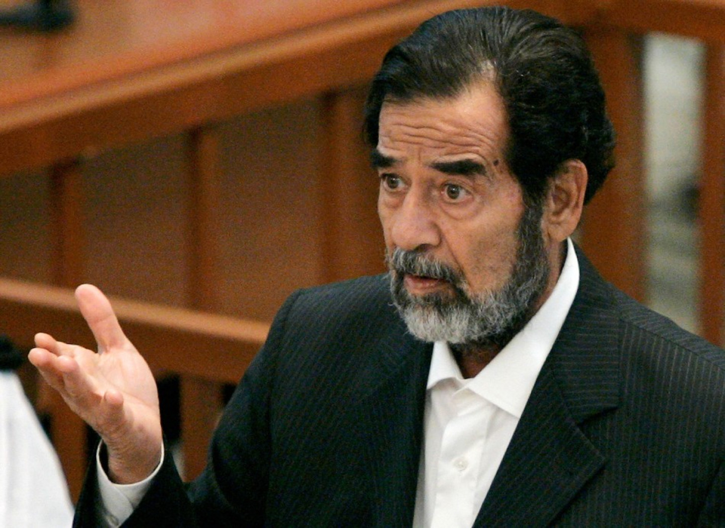 Former Iraqi leader Saddam addresses the court on the third day of his trial in Baghdad