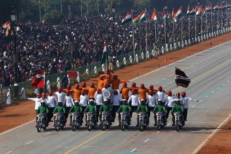 Indian Army soldiers perform a daredevil stunt during the Republic Day parade in New Delhi January 26, 2013