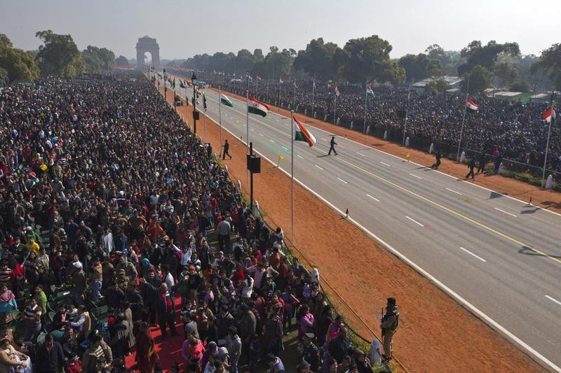 People watch the Republic Day parade in New Delhi January 26, 2013.