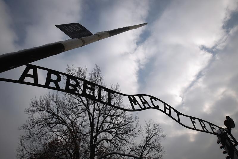 The sign Arbeit macht frei at the main gate to the Auschwitz concentration camp is seen on January 27, 2013. A ceremony to mark the 68th anniversary of the liberation of Auschwitz by Soviet troops and to remember the victims of the Holocaust w