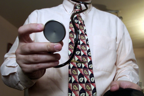 A general practicioner in Paris prepares to examine a patient in his Paris offic