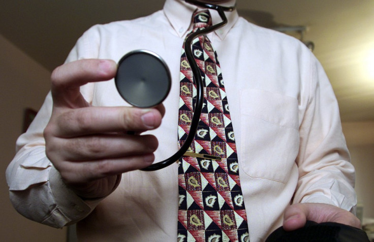 A general practicioner in Paris prepares to examine a patient in his Paris offic