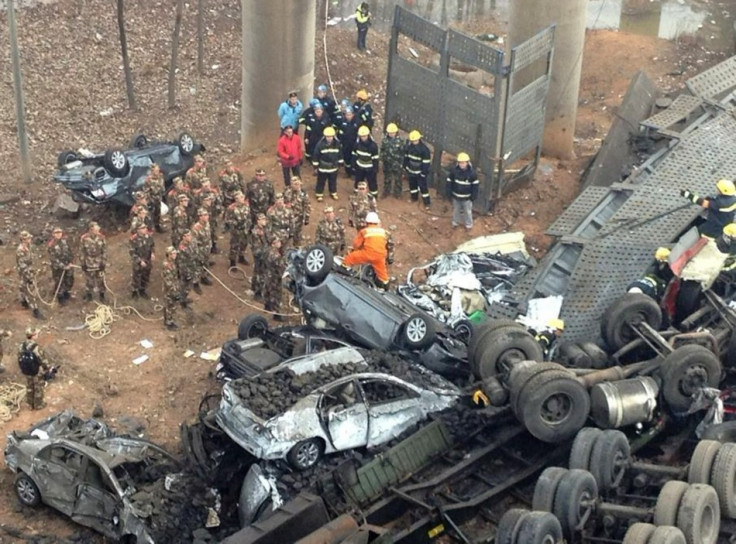 Rescuers look for survivors near the wreckage of vehicles after a expressway bridge partially collapsed on the Lianhuo highway in Mianchi county, Henan province (Reuters)