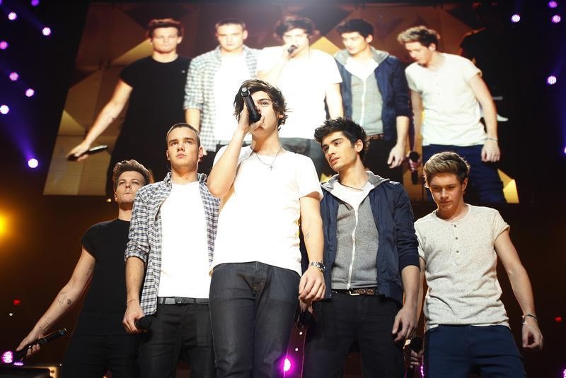 The One Direction band performs during the Z100 Jingle Ball at Madison Square Gardens in New York December 7, 2012. Seen are L-R Louis Tomlinson, Liam Payne, Harry Styles, Zayn Malik and Niall Horan.