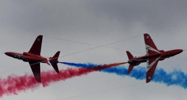 Members of the British Royal Air Force Red Arrows squadron perform a stunt (Reuters)