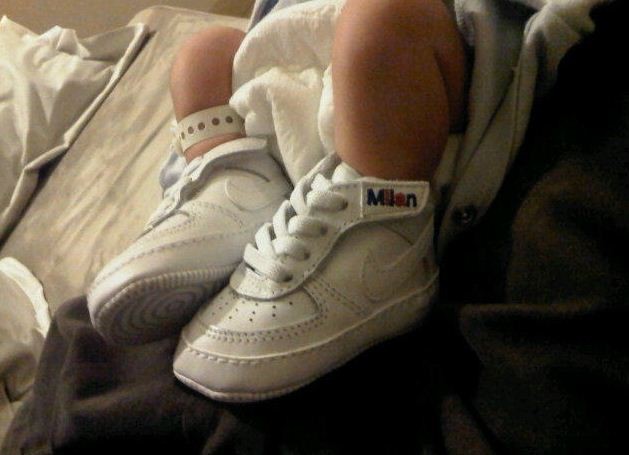 Gerard Pique shared a photo of his newborn son Milans tiny feet in white Nike sneakers, customized with his name