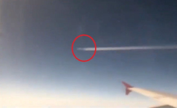 UFO whizzes past jet plane
