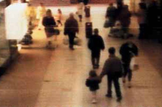 Tiny James Bulger is led by the hand to his death Tiny James Bulger is led by the hand to his death