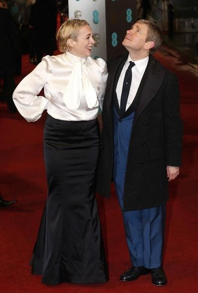 Martin Freeman poses with his wife Amanda Abbington as they arrive for the British Academy of Film and Arts BAFTA awards ceremony at the Royal Opera House in London February 10, 2013.